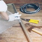 man-is-working-with-mosquito-wire-screen-installation